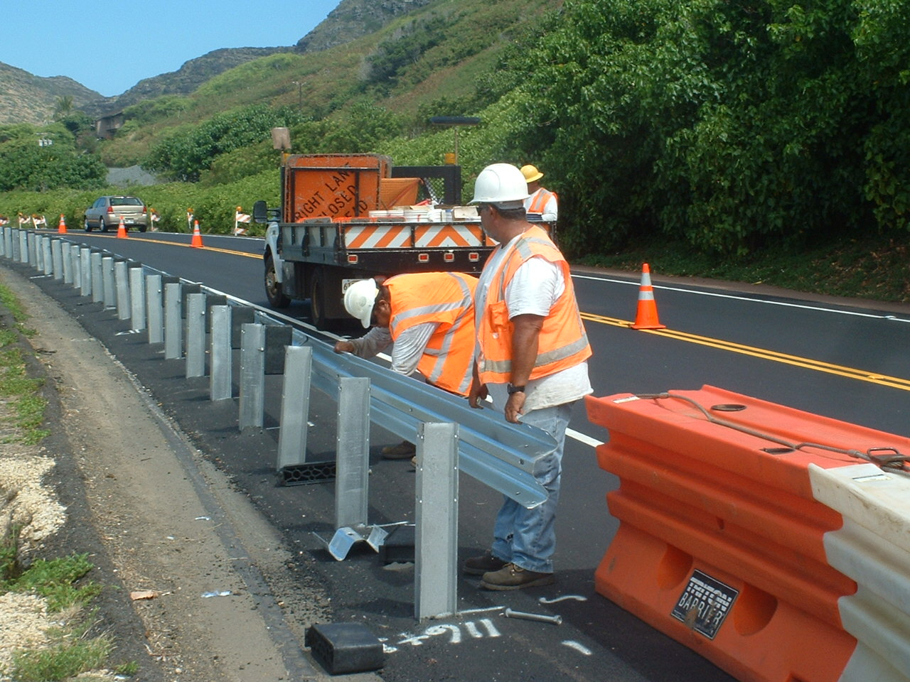 Roadway safety equipment installation in progress